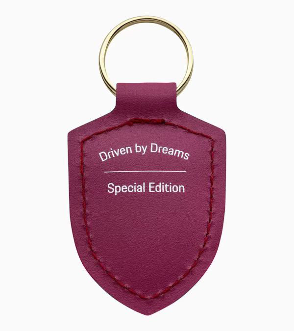 porsche | keyring | RubyStar | Metal | Leather | 75 years anniversary | from or product | Gold Porsche crest | Back of product | Driven by Dreams | Gold keyring | Special Edition | Unisex